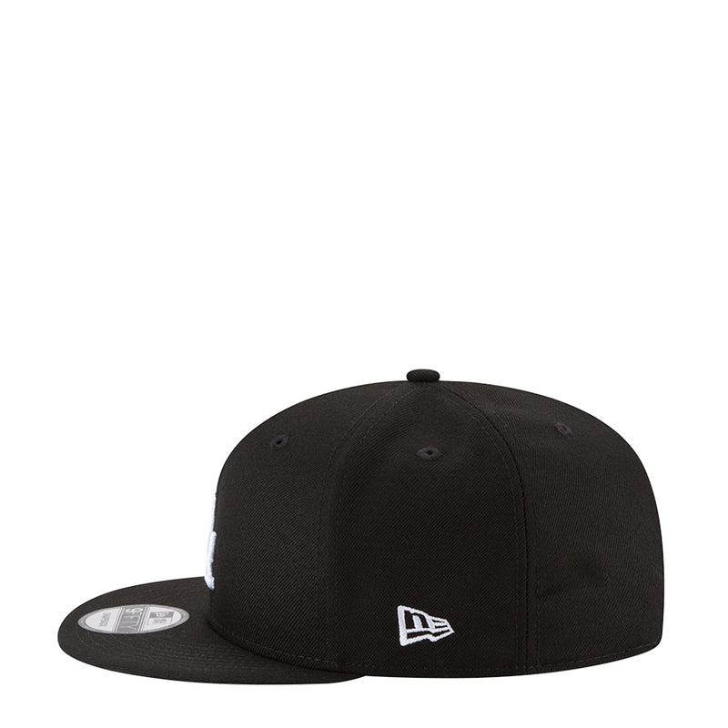 Black baseball cap with New Era flag on front panel