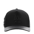Black pinch-front strapback cap with raised Dodgers 'LA' logo and gray underbrim