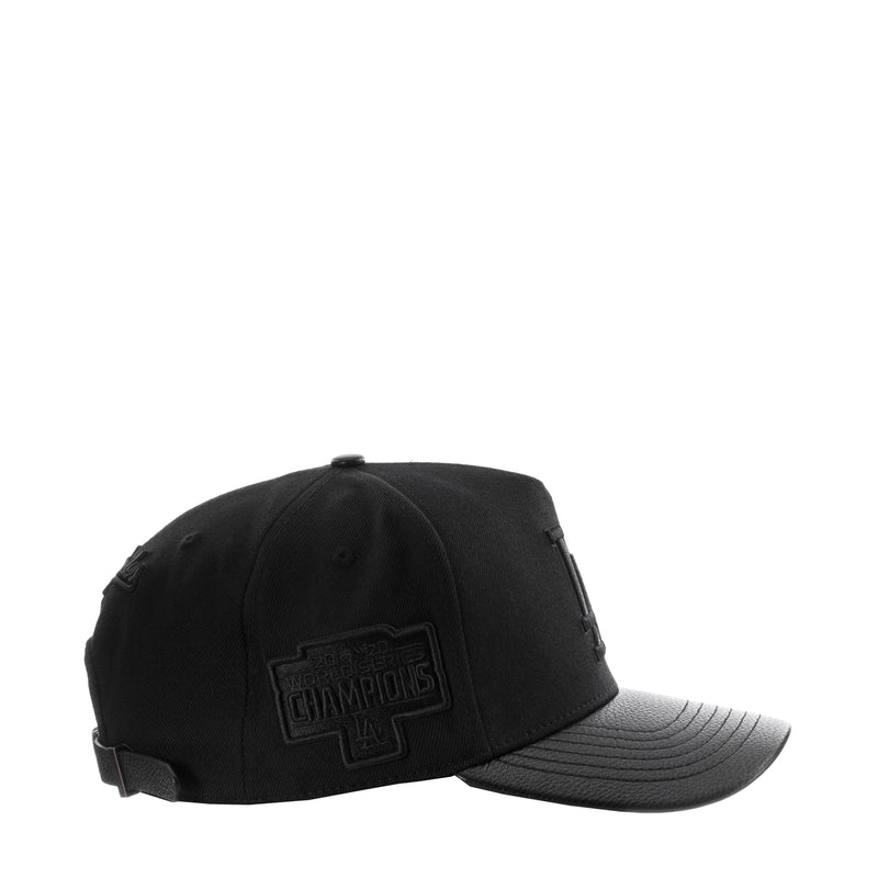 Black pinch-front strapback cap with side league patch and curved gray brim