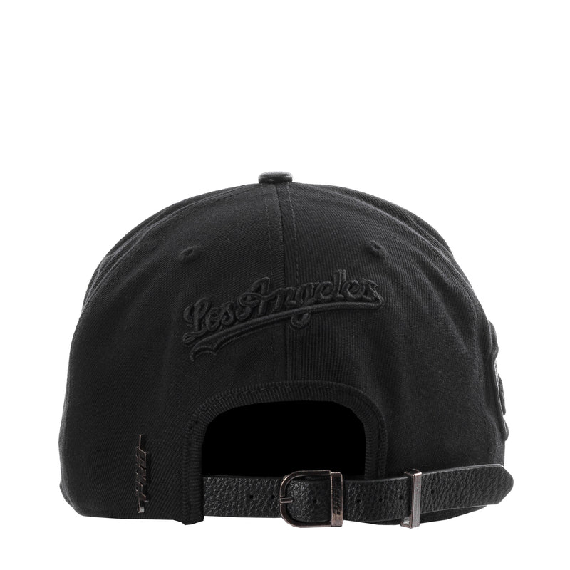 Black strapback cap with back script logo and adjustable black leather buckle strap