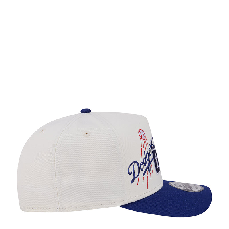 Two-tone baseball cap, side view with Dodgers script and blue underbrim