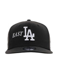 Black baseball cap with East LA logo and white LA monogram on front
