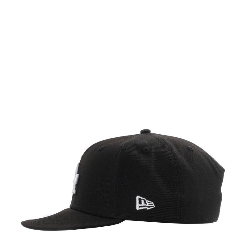 Black baseball cap with New Era flag logo on front panel