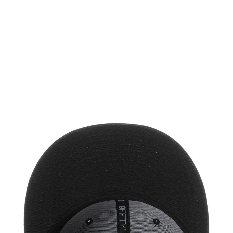 Black baseball cap crown close-up with stitched fabric texture