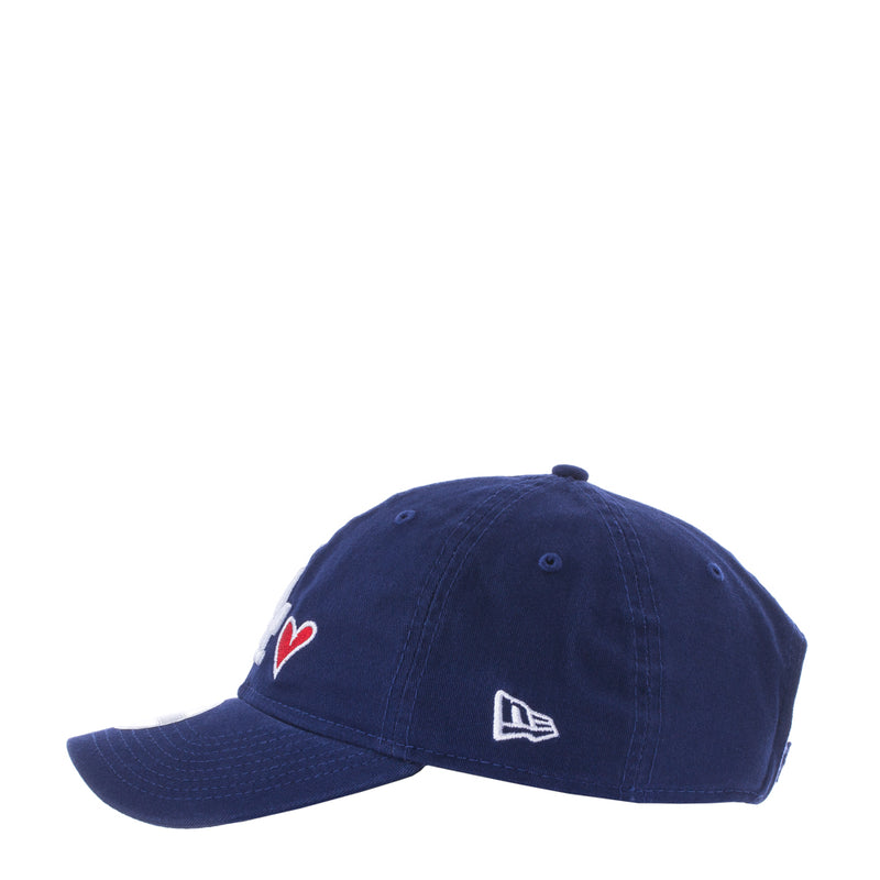 Royal blue baseball cap with red heart icon and New Era flag logo