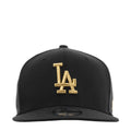 Black baseball cap with gold LA logo on front