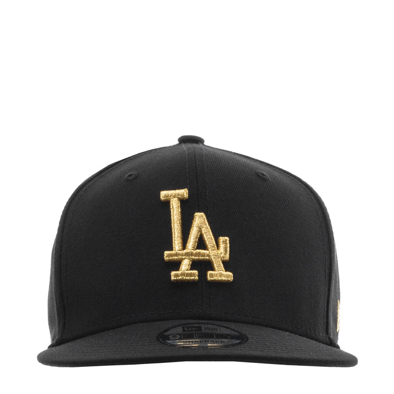 Black baseball cap with gold LA logo on front