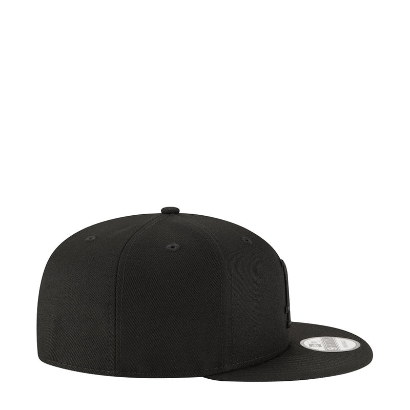 Black baseball cap with curved brim and structured, stitched crown panels