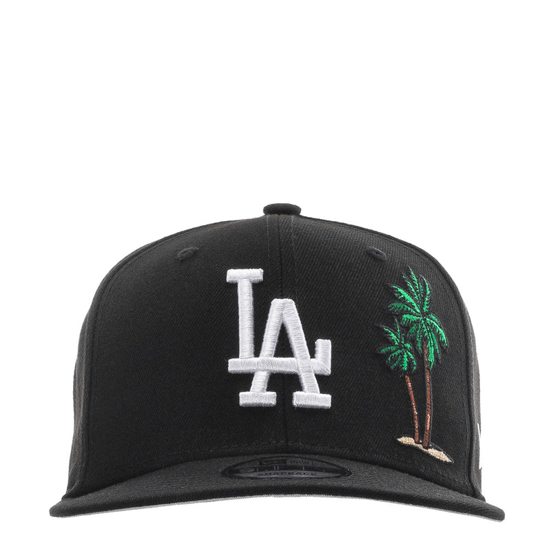 Black baseball cap with white LA logo and colorful palm tree embroidery on front