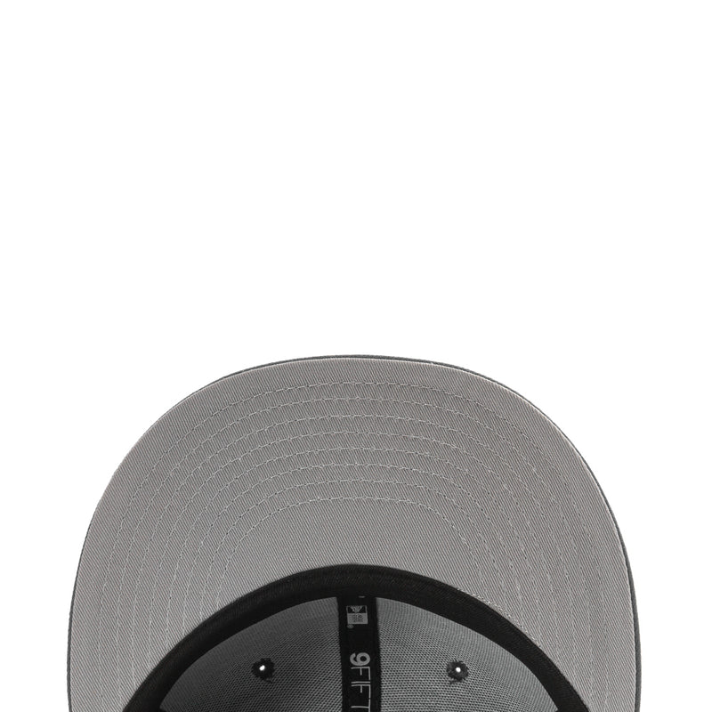 Gray cap interior panel with black inner band and eyelets under the brim