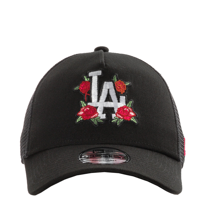 Black trucker cap with LA lettering and red rose embroidery on the front