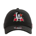 Black trucker cap with LA lettering and red rose embroidery on the front