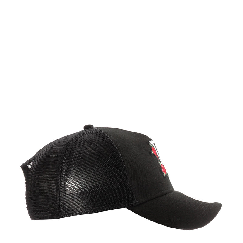 Black trucker cap side view with mesh panels and small rose detail