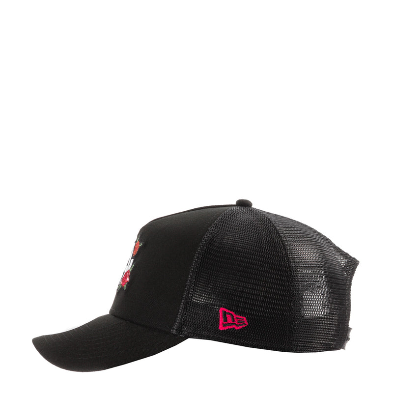 Black trucker cap with red 'De' logo on side and rose embroidery