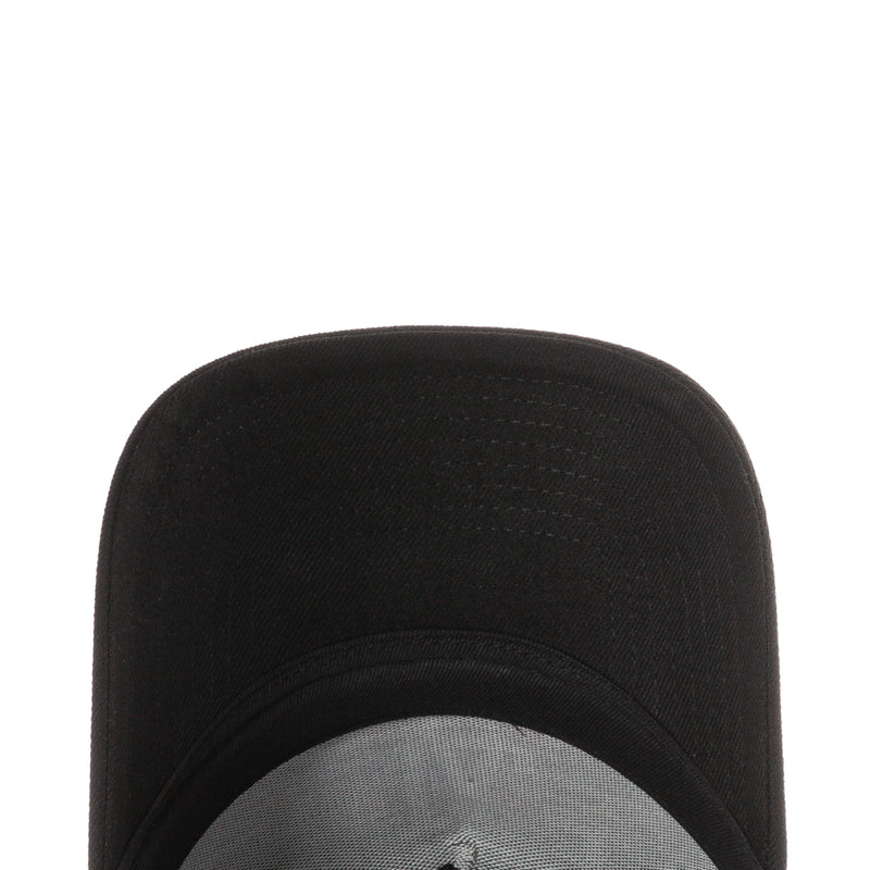 Black trucker cap crown with textured fabric and stitched seams