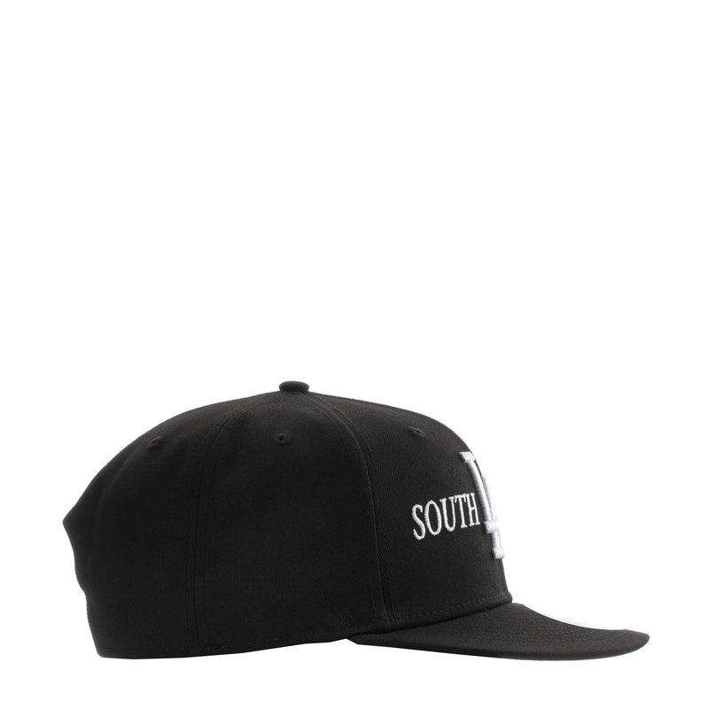 Black baseball cap with white SOUTH lettering on side panel, curved brim