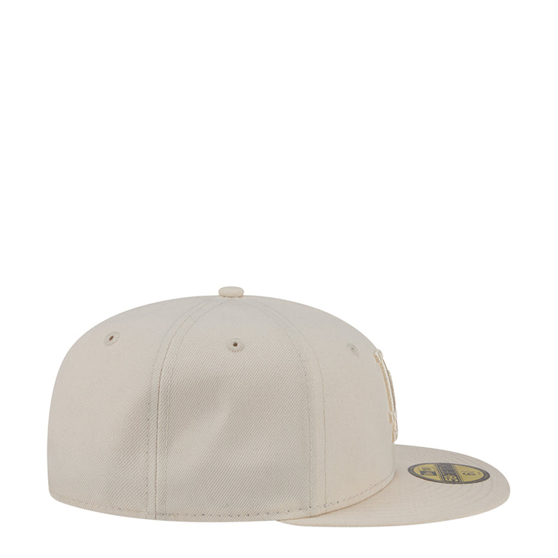 Light cream baseball cap with curved brim, tonal eyelets, and stitched crown panels