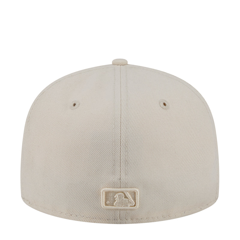 Light cream baseball cap with embroidered emblem on the back