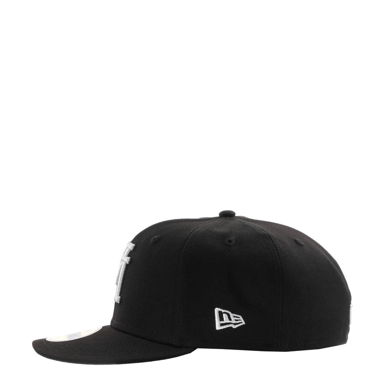 Black baseball cap with white New Era logo on side