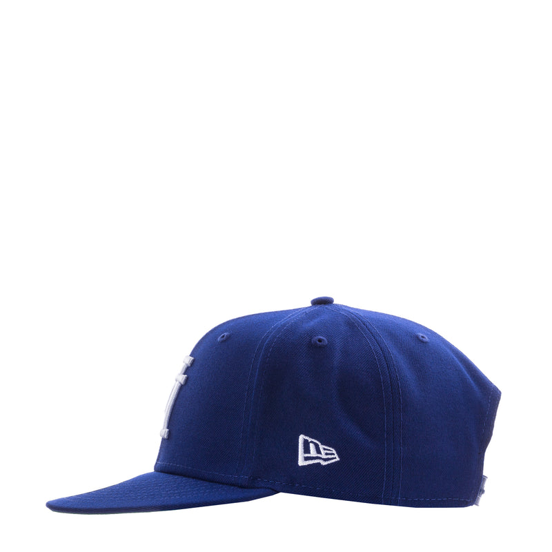 Royal blue baseball cap with New Era flag logo on the side
