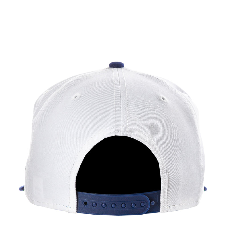 White baseball cap back with blue snapback strap and vented eyelets