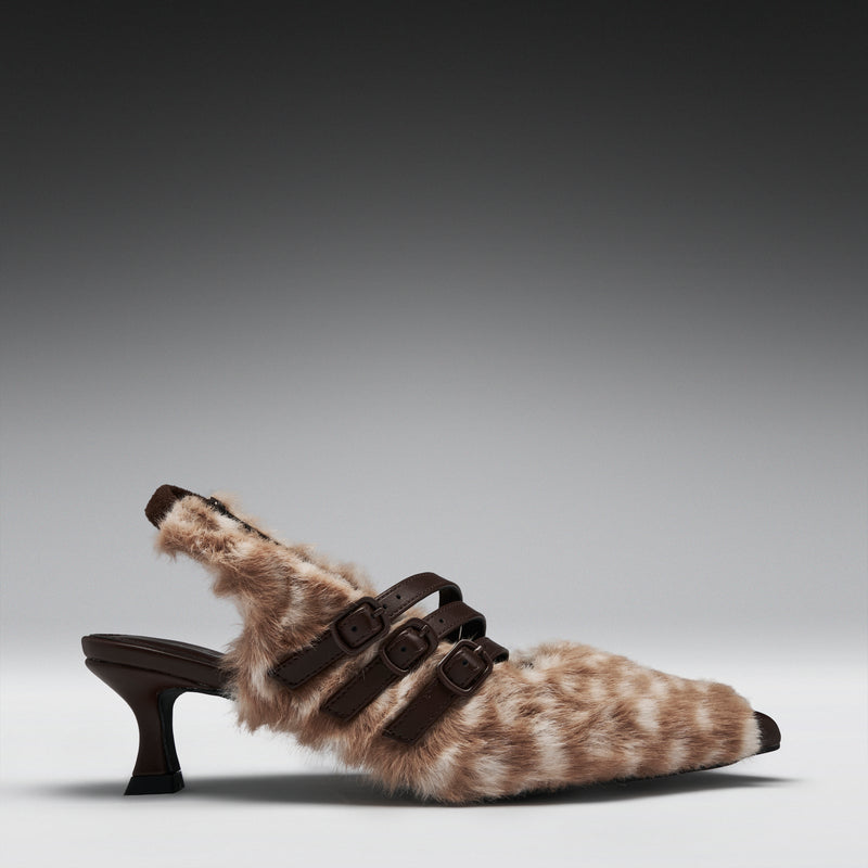 A single women's kitten heel with a brown and beige animal-print faux fur upper, dark brown buckle straps, and a dark brown block heel, shown against a gray gradient studio background.