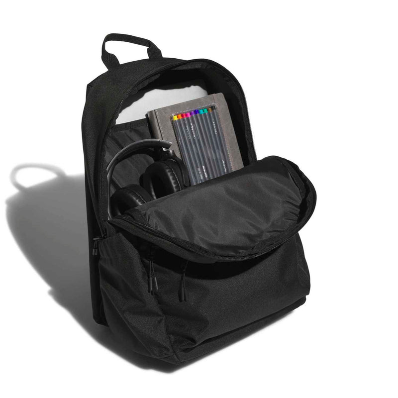 Black backpack opened to show laptop sleeve and interior organizer compartments