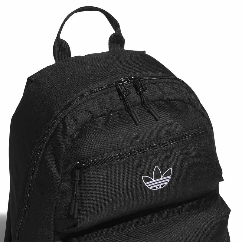 Black backpack with front zip panel and small white logo emblem
