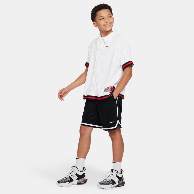 Youth black shorts with white side stripes, Nike logo, and elastic waistband