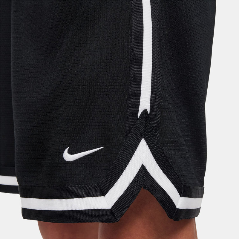 Black shorts hem with Nike logo and white chevron trim