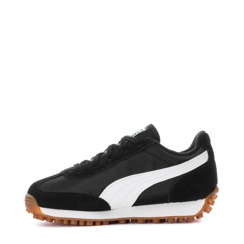 Kids Puma sneaker, black upper with white mid panel and gum outsole, side view.