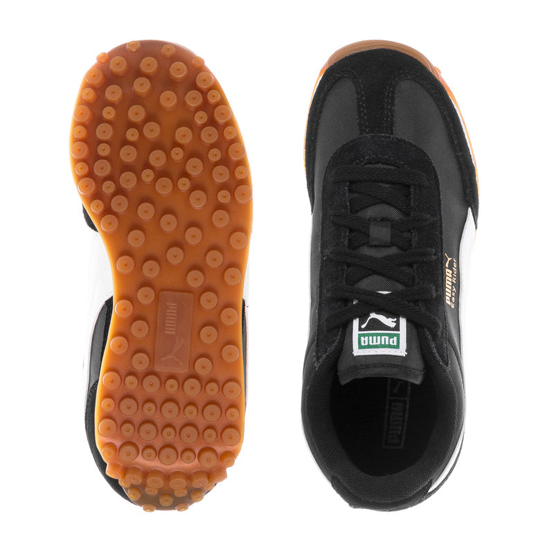Kids Puma sneaker soles: gum tread outsole and black interior lace-up view.
