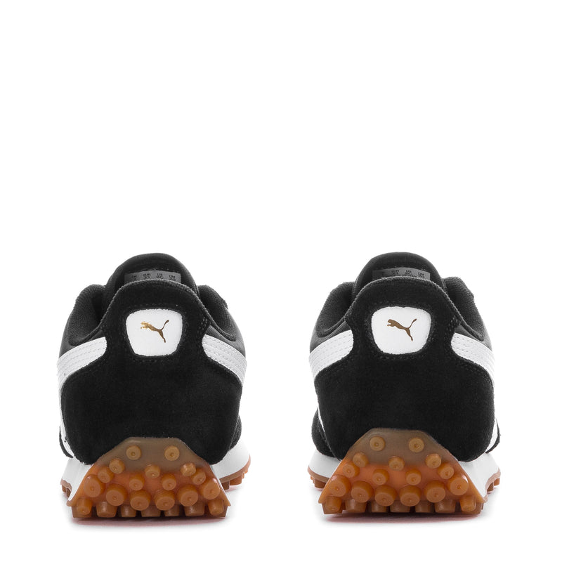 Kids Puma sneaker heels with Puma logo and gum tread outsole, back view pair.