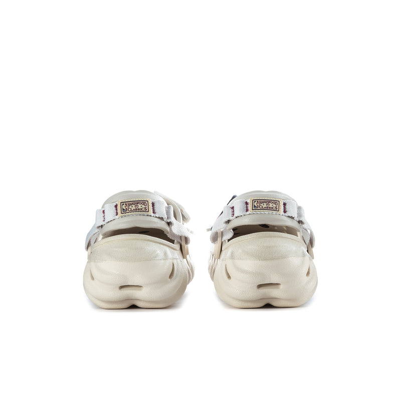 Men's off-white Echo clogs, rear view with adjustable strap and heel tabs