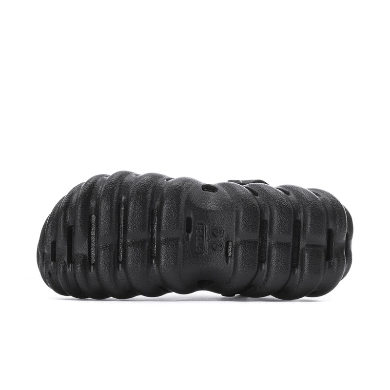 Men's black clog outsole with deep tread and molded traction pattern