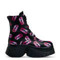 Black platform boots with a pattern of pink razorblade prints, featuring a lace-up front and a chunky sole.