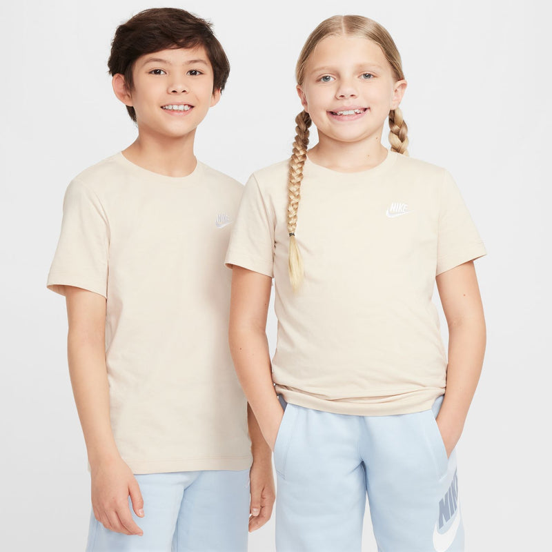 Youth sandrift embroidered tee with chest Nike logo, worn by kids