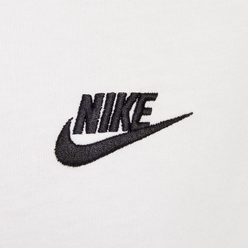Close-up of white tee with embroidered Nike swoosh logo