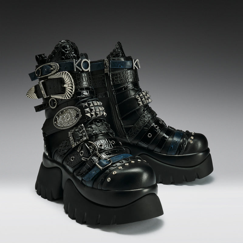 Black platform boots with decorative elements on a gradient background