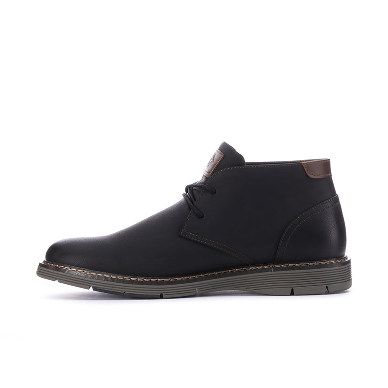 Men's black leather chukka boot with lace-up, side stitching, and brown tab