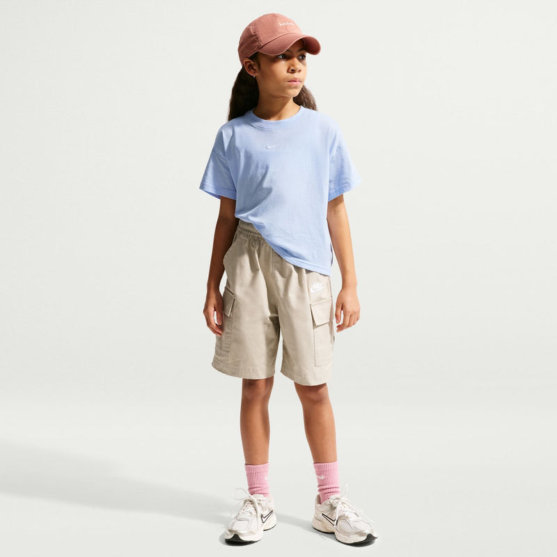 Youth boxy T-shirt in light blue, side view with short sleeves and swoosh on front