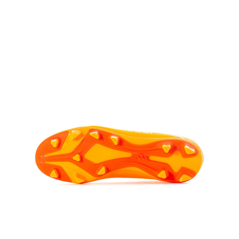 Youth soccer cleat outsole, orange molded traction studs on a light base.