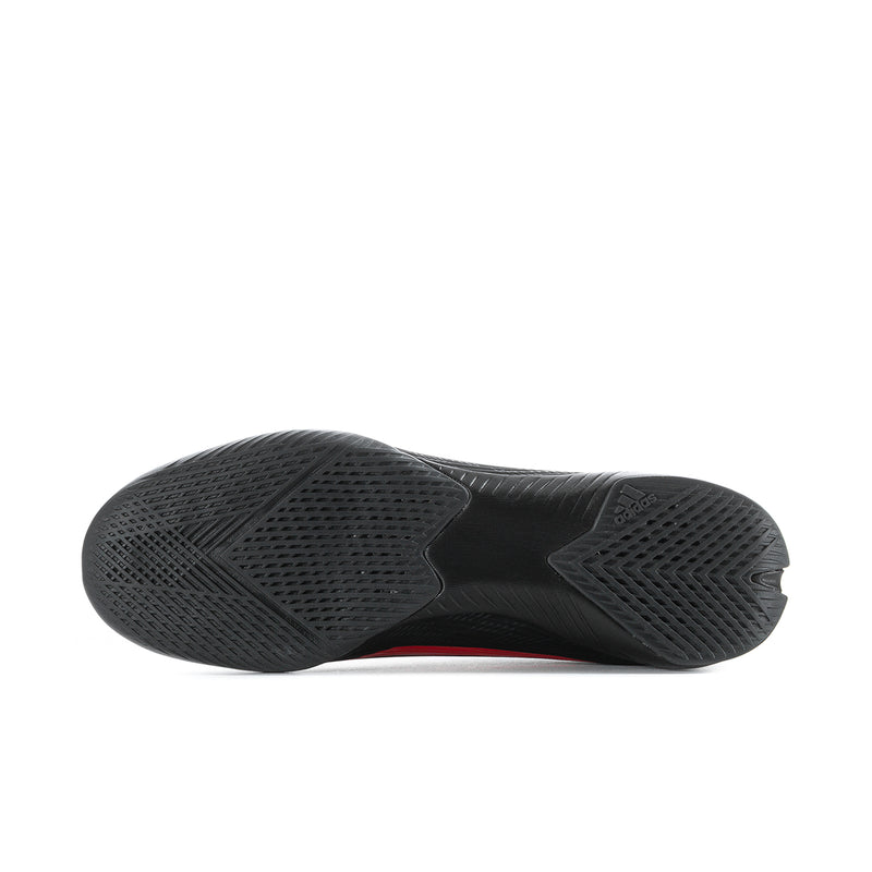 Black rubber outsole for soccer cleats with molded tread pattern.