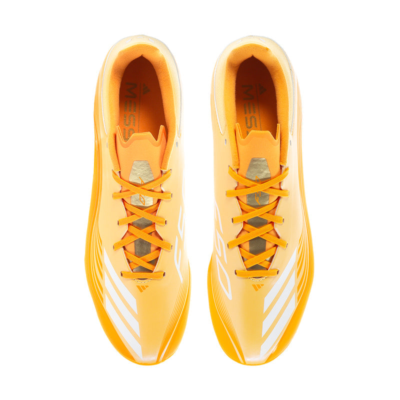 Pair of men's low-top soccer cleats, front view showing orange lace-up closure