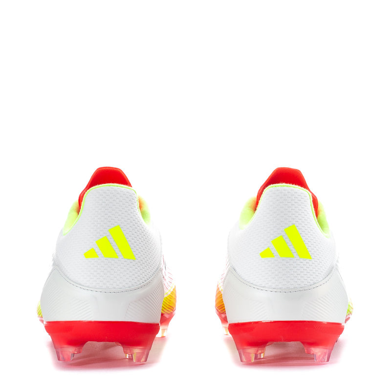 White/red/yellow soccer cleats, heel view with red accents and molded studs