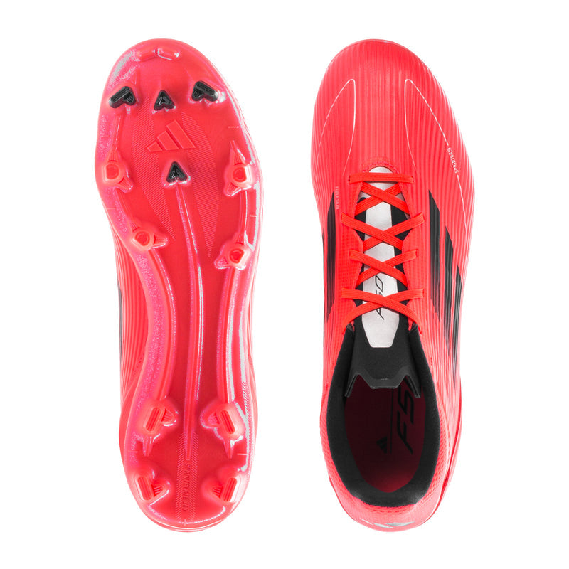 Red football cleat pair with molded studs on the outsole and lace-up openings.