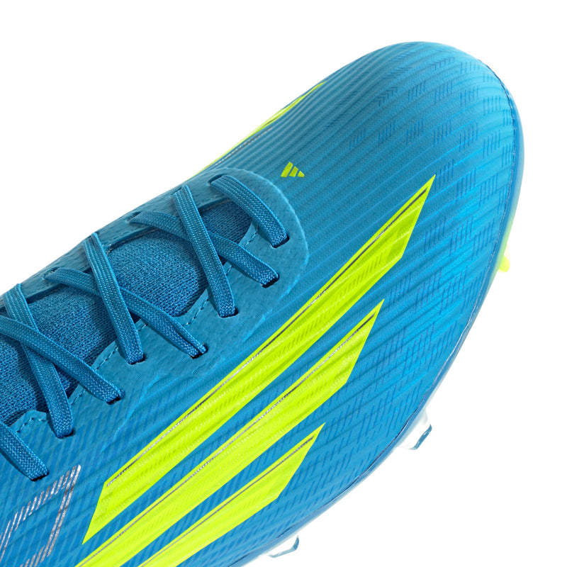 Men's mid-top football boot upper close-up, bright blue laces and neon yellow stripes