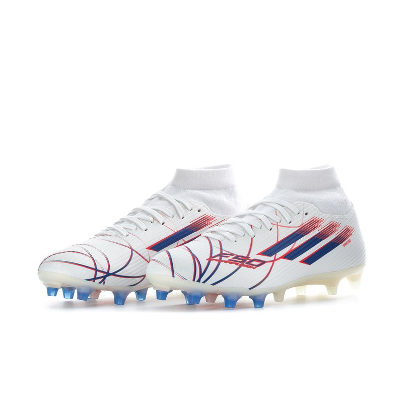 Women’s mid-cut soccer cleats with white upper, blue/red stripe details, blue studs