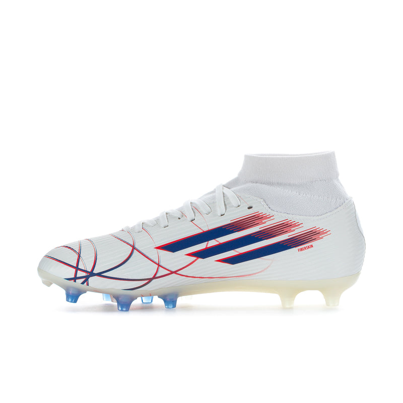 Women’s mid-cut soccer cleats in white, blue/red graphic stripe, visible blue studs
