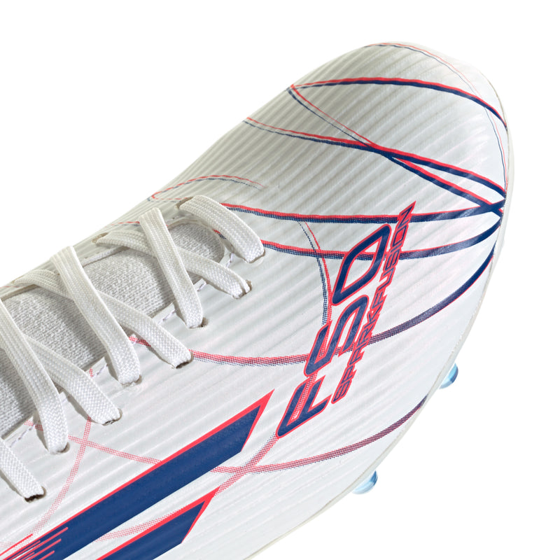 Women’s mid-cut soccer cleat close-up, white laces with blue and red logo artwork